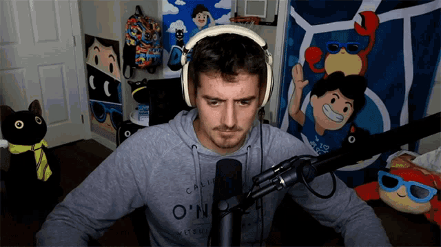a man wearing headphones and a california o'neill sweatshirt