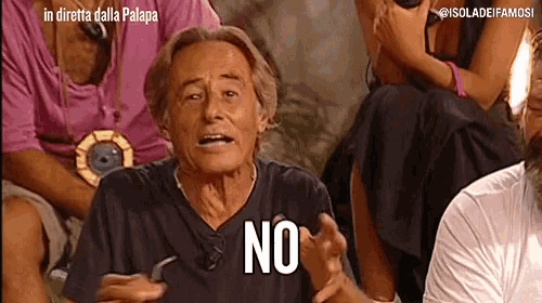 a man in a black shirt says no in front of a crowd of people