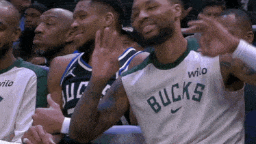 a group of basketball players wearing jerseys that say wilo on them