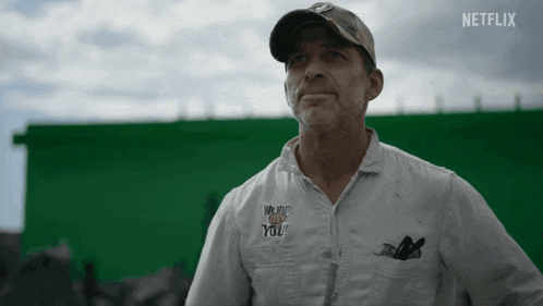 a man wearing a white shirt that says netflix