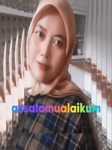 a woman wearing a hijab and a plaid shirt with the words assalamualaikum on the bottom right