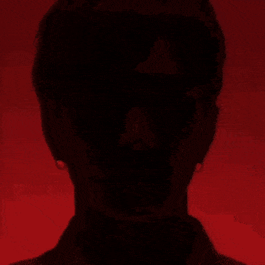 a close up of a man 's face with his eyes closed .