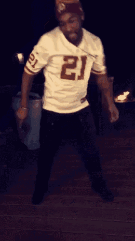 a man in a white jersey with the number 21 on it