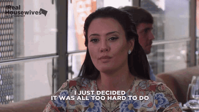 a woman says " i just decided it was all too hard to do " while sitting at a table