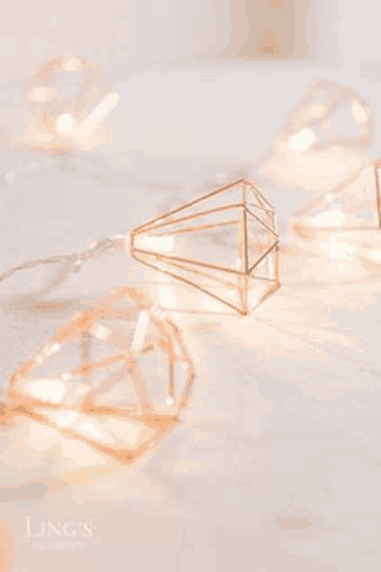 a string of diamond shaped lights on a table .