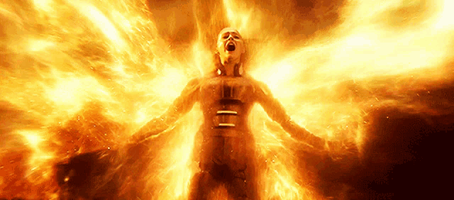 a woman is surrounded by flames with the letter e visible