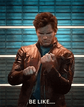 a man in a leather jacket is making a fist and saying `` be like '' .