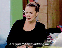 a woman says " are you f *** ing kidding me " while holding a cell phone