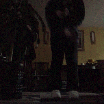 a blurry picture of a person in a living room