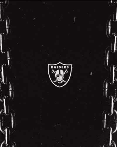 a black and white photo of a chain around a letter h