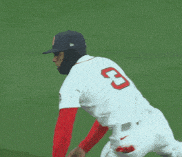 a baseball player for the red sox wearing a mask and glove