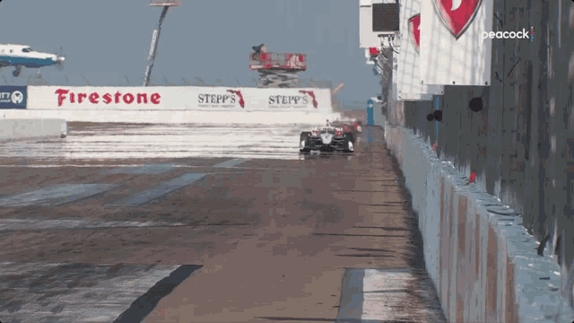 a race track with a sign that says firestone and steppy 's on it