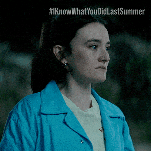 a woman in a blue jacket with the hashtag #iknowwhatyoudidlastsummer