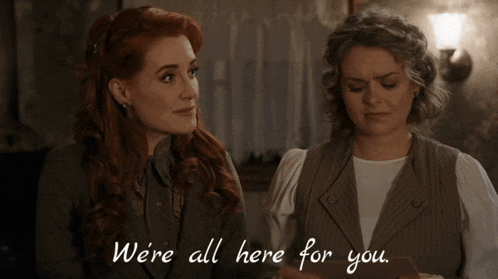 two women standing next to each other with the words " we 're all here for you "