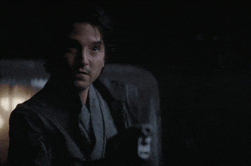 a man in a dark room with the words " you 're gonna have to think about that " above him