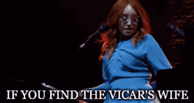 a woman singing into a microphone with the words if you find the vicar 's wife above her