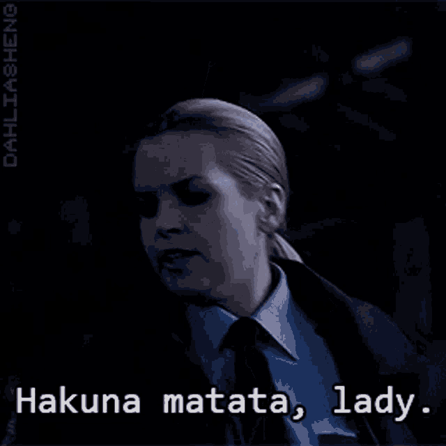 a woman in a blue shirt and black tie says hakuna matata lady ..