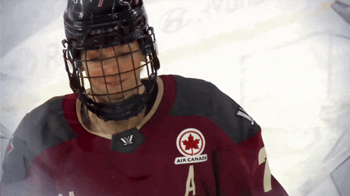 a hockey player is wearing a jersey that says air canada on it