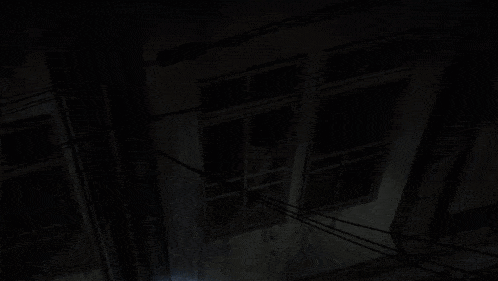 a cartoon of a man standing in a dark alleyway with a light on