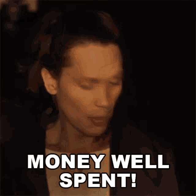 a man is making a face and saying money well spent .