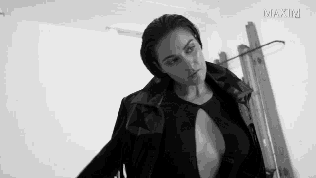 a black and white photo of a woman with the word maxim on the bottom left