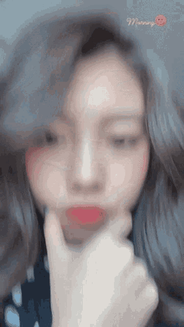 a blurred image of a woman with the word morning written on the bottom