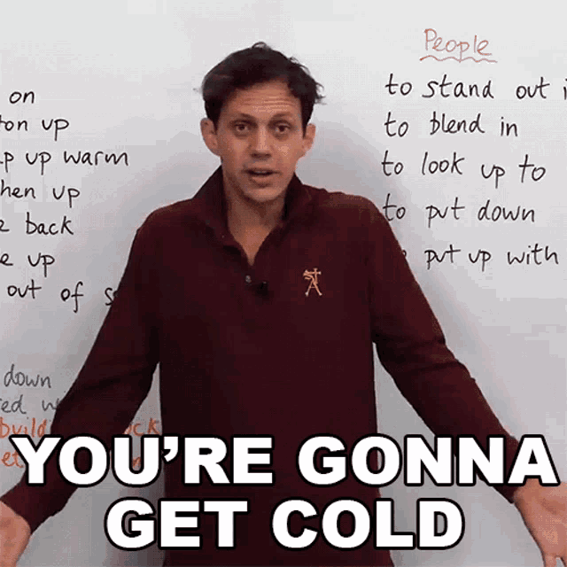 a man stands in front of a white board with the words you 're gonna get cold