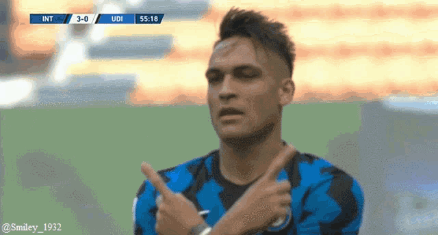 a soccer player giving a thumbs up during a game with the score 3-0