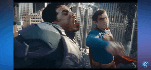 a man in a superman costume is fighting another man in a superhero costume