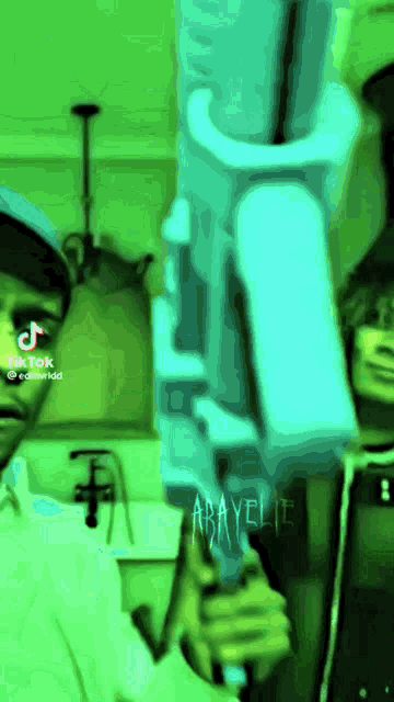 a tiktok video of a man holding a gun with the name abayelite written on it