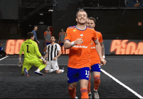 a soccer player with the number 11 on his shirt