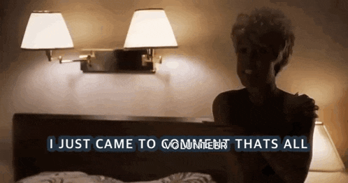 a woman sitting on a bed with the words " i just came to comment thats all "