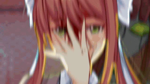 a close up of a girl with red hair covering her face with her hand .