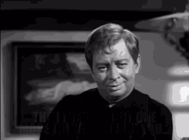 a black and white photo of a man with the words " then i 've just got one thing to teach you " behind him