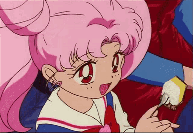 a little girl with pink hair is holding a piece of cake with a fork in her hand .