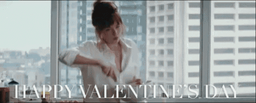 a woman sitting in front of a window with the words happy valentine 's day written above her
