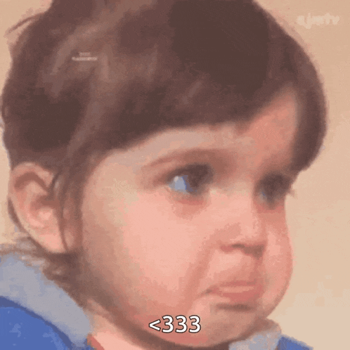 a little girl is crying with the number 333 on her face
