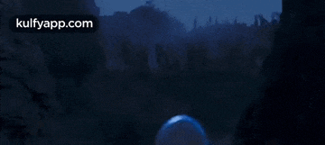 a blurred image of a dark landscape with the words kulfyapp.com on the bottom