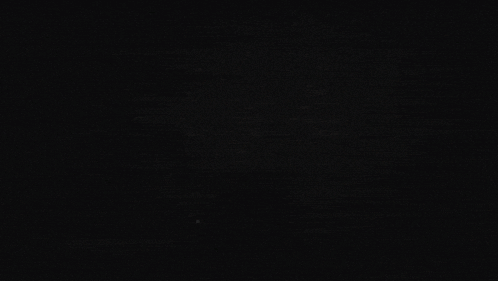a close up of a person 's face in the dark