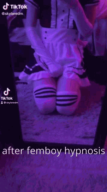 a person in a maid costume is dancing in front of a purple light .