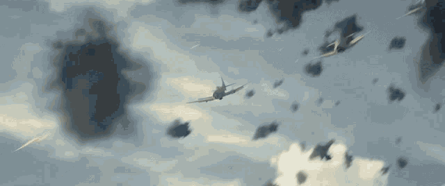 a plane is flying through a cloudy sky with the letters u.s. on the side