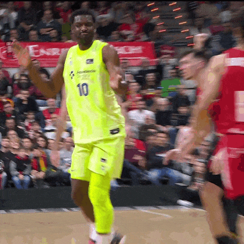 a basketball player wearing a neon yellow jersey with the number 10