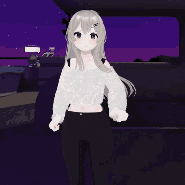 a girl in a white sweater and black jeans is kneeling down
