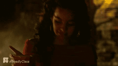 a close up of a woman 's face with the hashtag #deadlyclass on the bottom