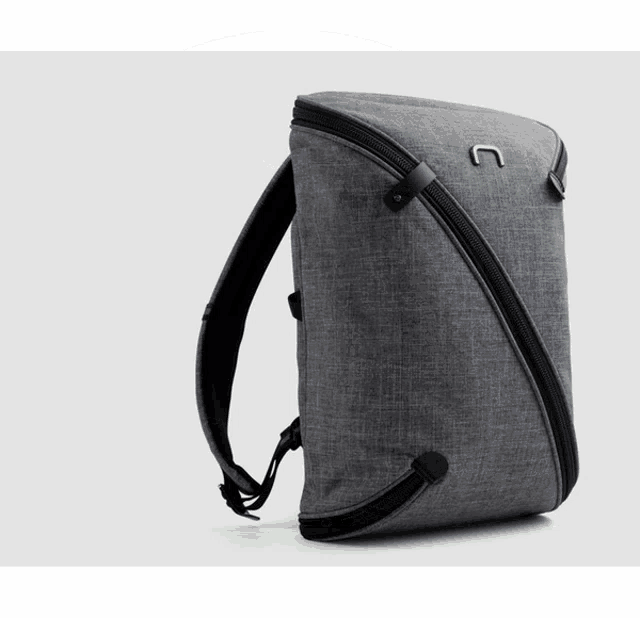 a gray backpack with a black zipper and the letter n on it
