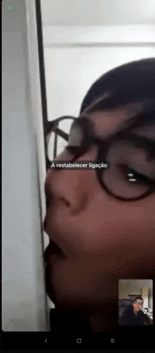 a person wearing glasses is on a video call