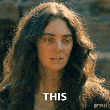 a woman 's face is shown with the word this behind her