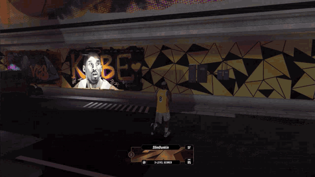 a basketball player is standing in front of a mural of kobe