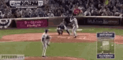 a baseball game is being played on a field with a t mobile sign in the background