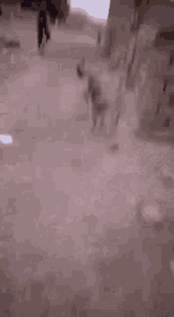 a person is laying on the ground with their feet up .